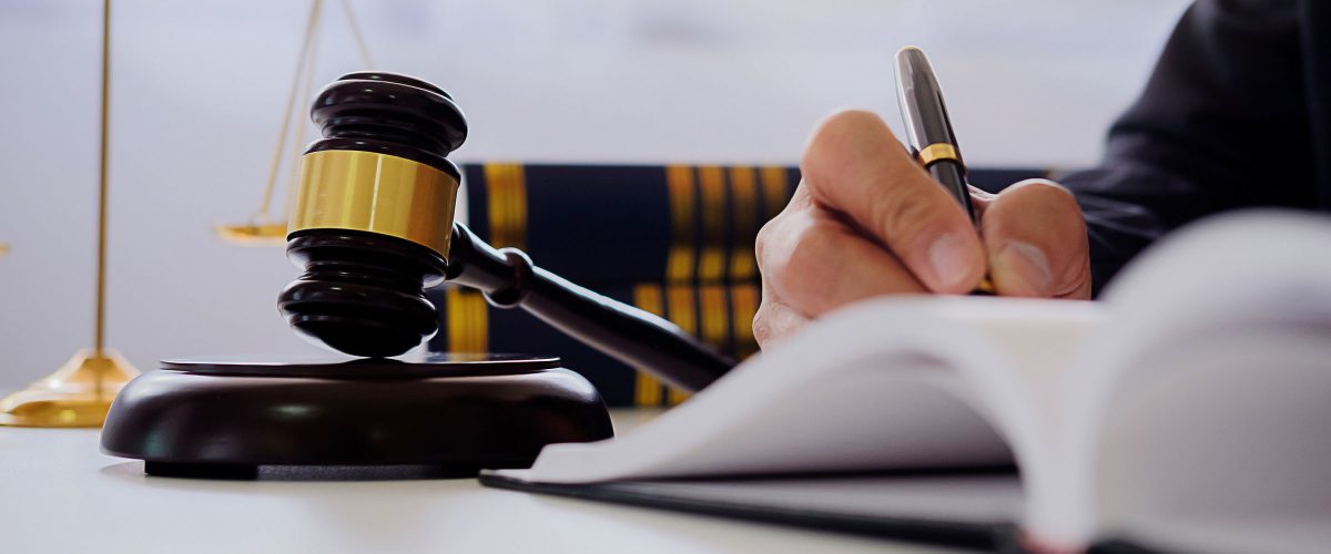 judge-gavel-with-justice-lawyers-having-team-meeti-HMWWXEN.jpg