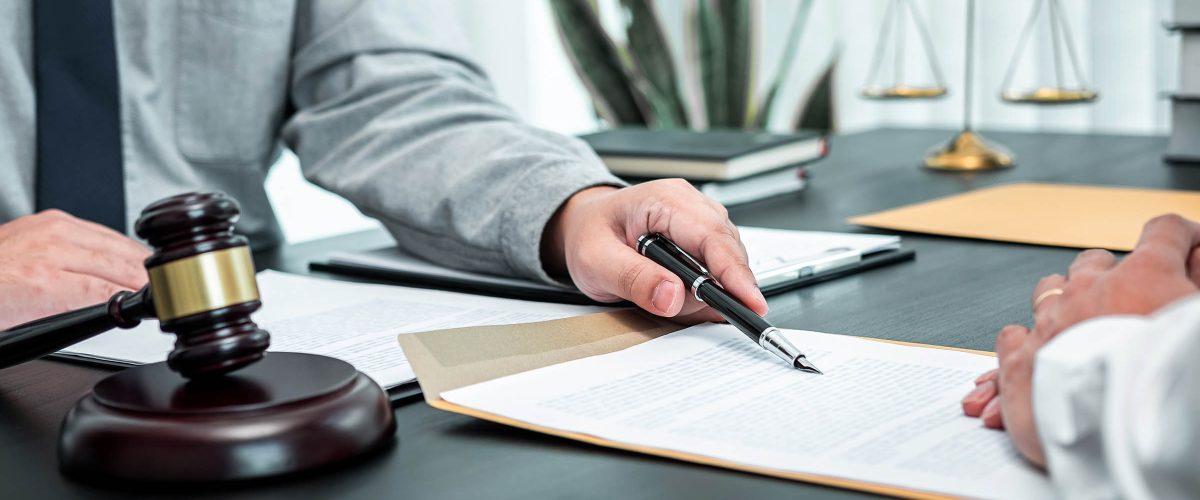 male-lawyer-discussing-negotiation-legal-case-with-AC56G3W.jpg